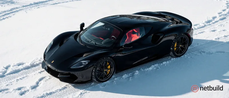 High-angle shot of a glossy black mid-engine sports car parked on pristine, bright white snow. The aerodynamic body reflects the clear natural dayligh...