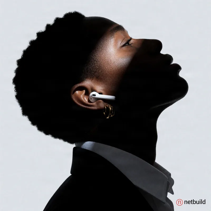 Profile silhouette of a person with short textured hair tilted upward, a sharp diagonal sliver of cool spotlight piercing deep facial shadows to illum...